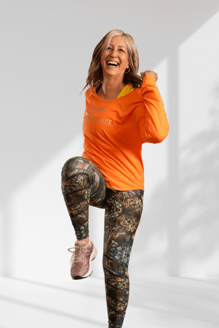 Creating | Orange long sleeve activewear top for women