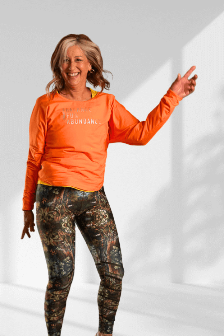 Creating | Orange long sleeve activewear top for women
