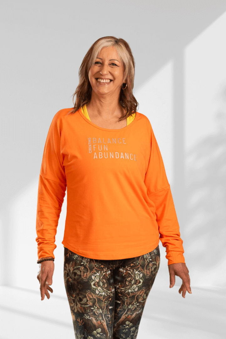 Creating | Orange long sleeve activewear top for women