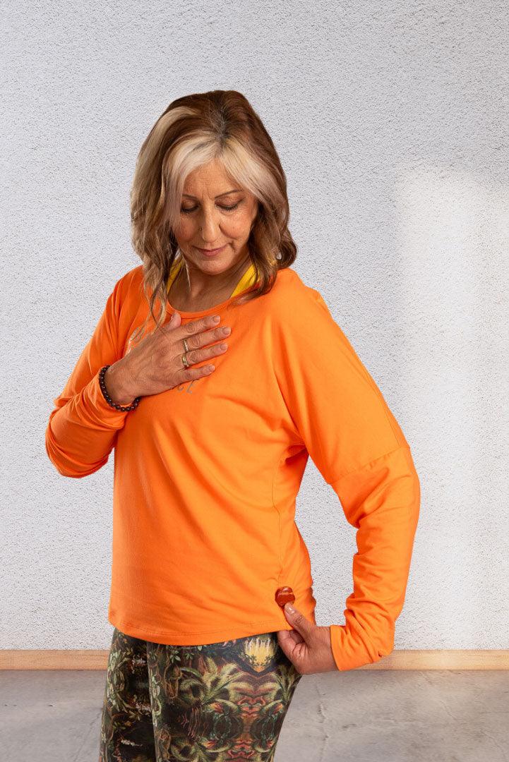 Creating | Orange long sleeve activewear top for women